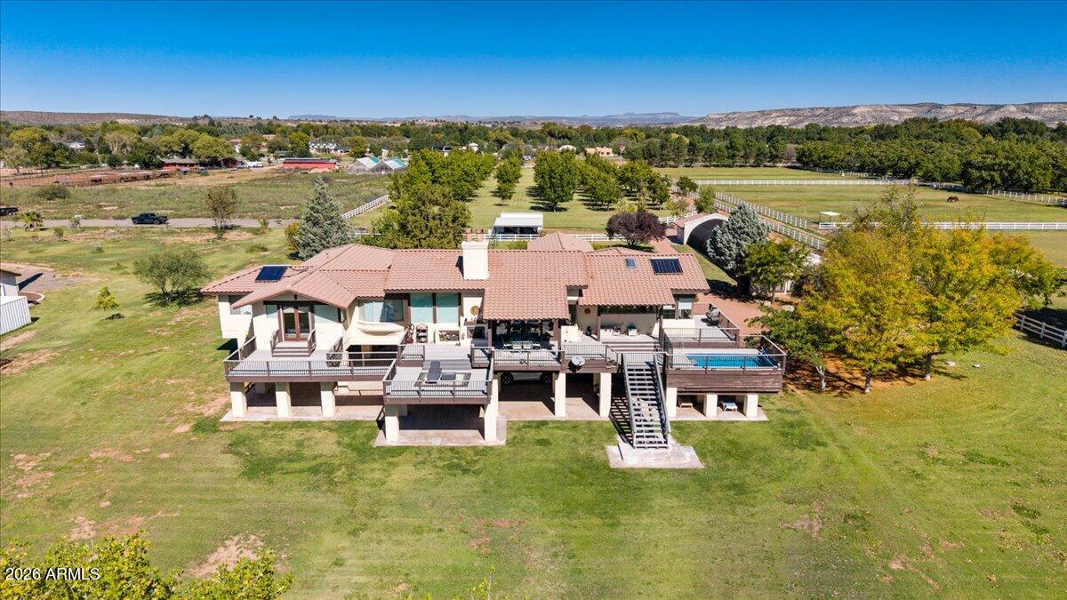 a aerial view of a house with a lake view