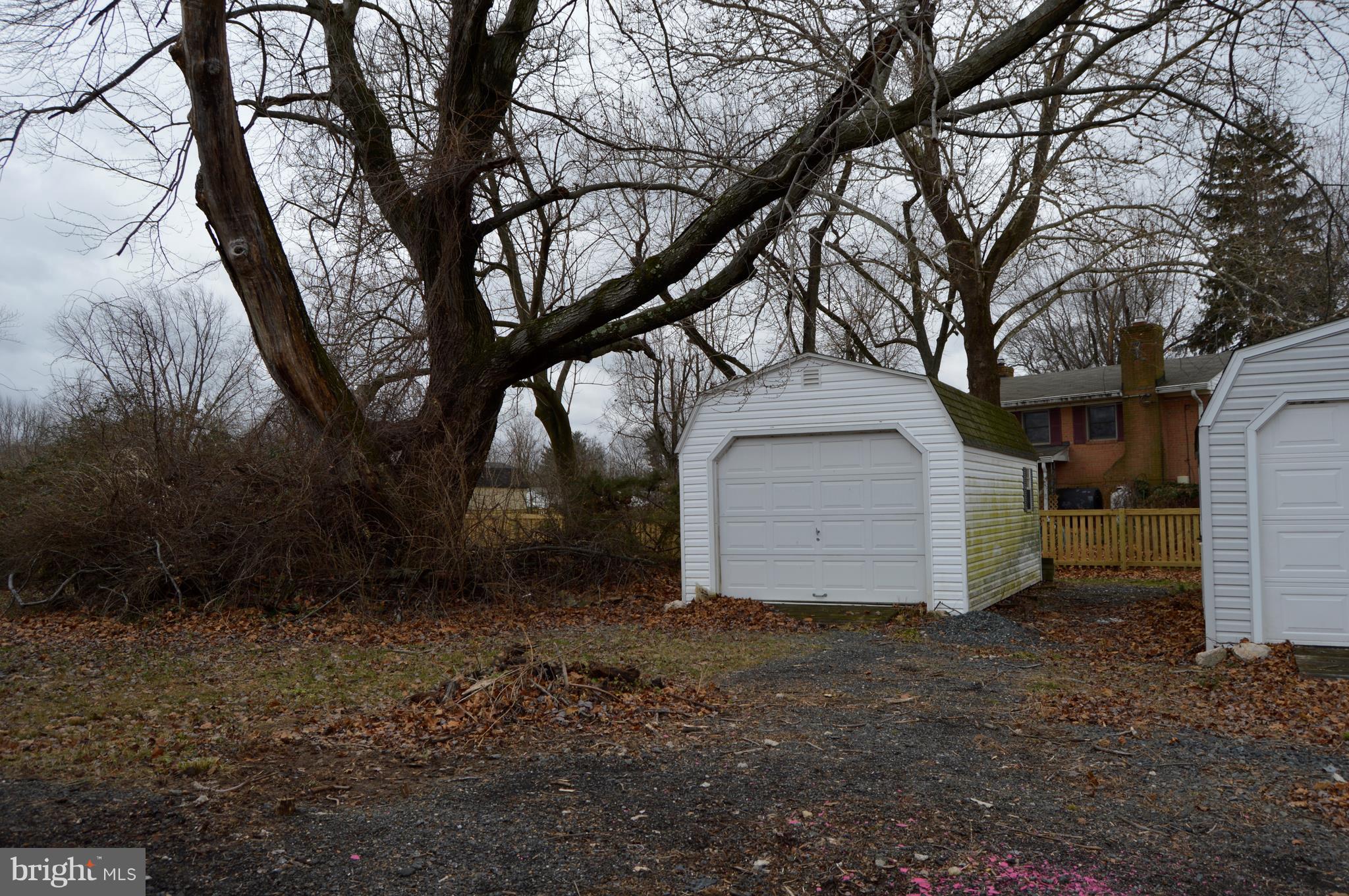 15510 Peach Orchard Road Silver Spring, MD 20905 - Photo 5 of 9 a view of a house with a large tree