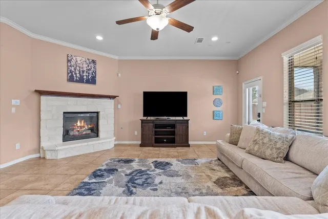 a bedroom with a bed chandelier and a window