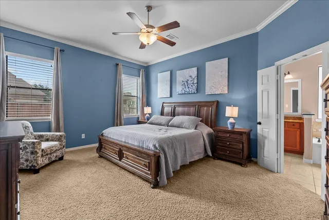 a bedroom with a bed and dresser