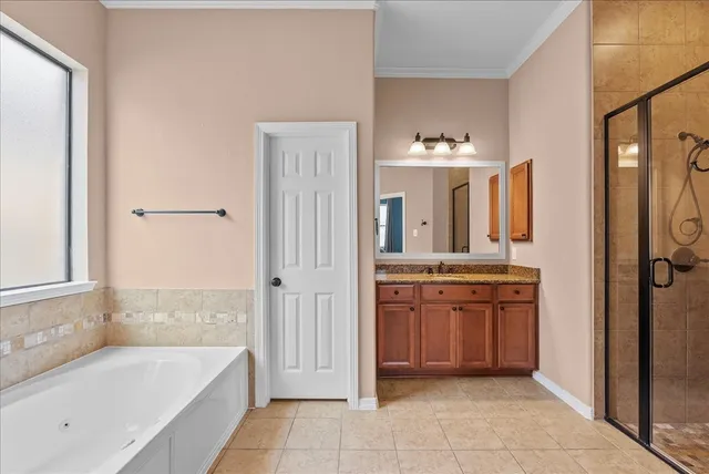 a bathroom with a granite countertop sink mirror and a shower