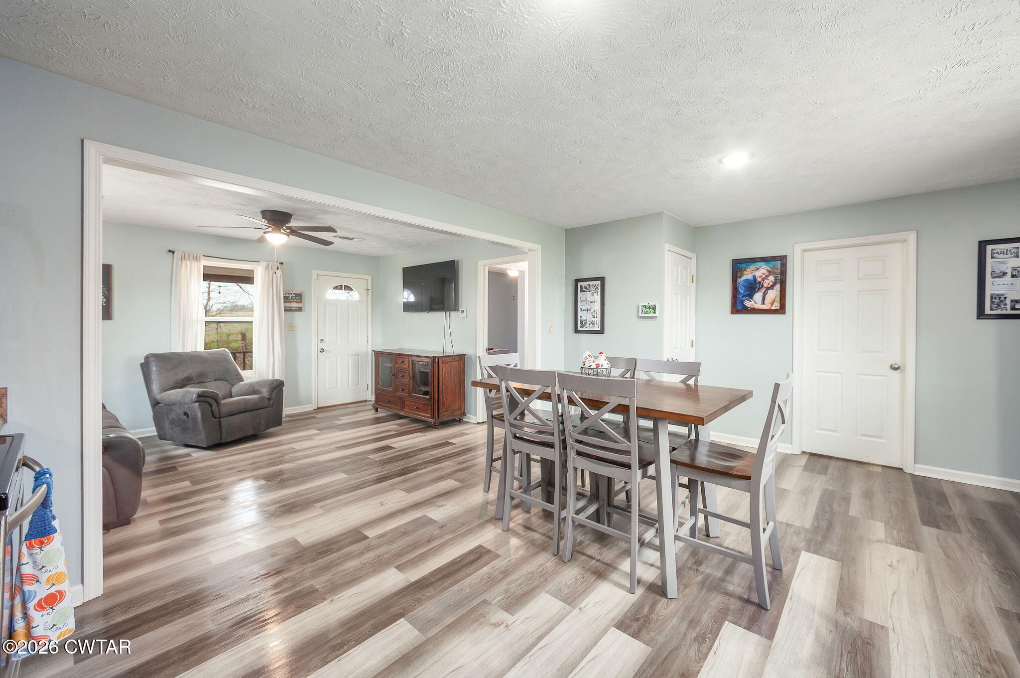 919 Bratt Thomas Road Brownsville, TN 38012 - Photo 15 of 29 a living room with furniture a dining table and a fireplace