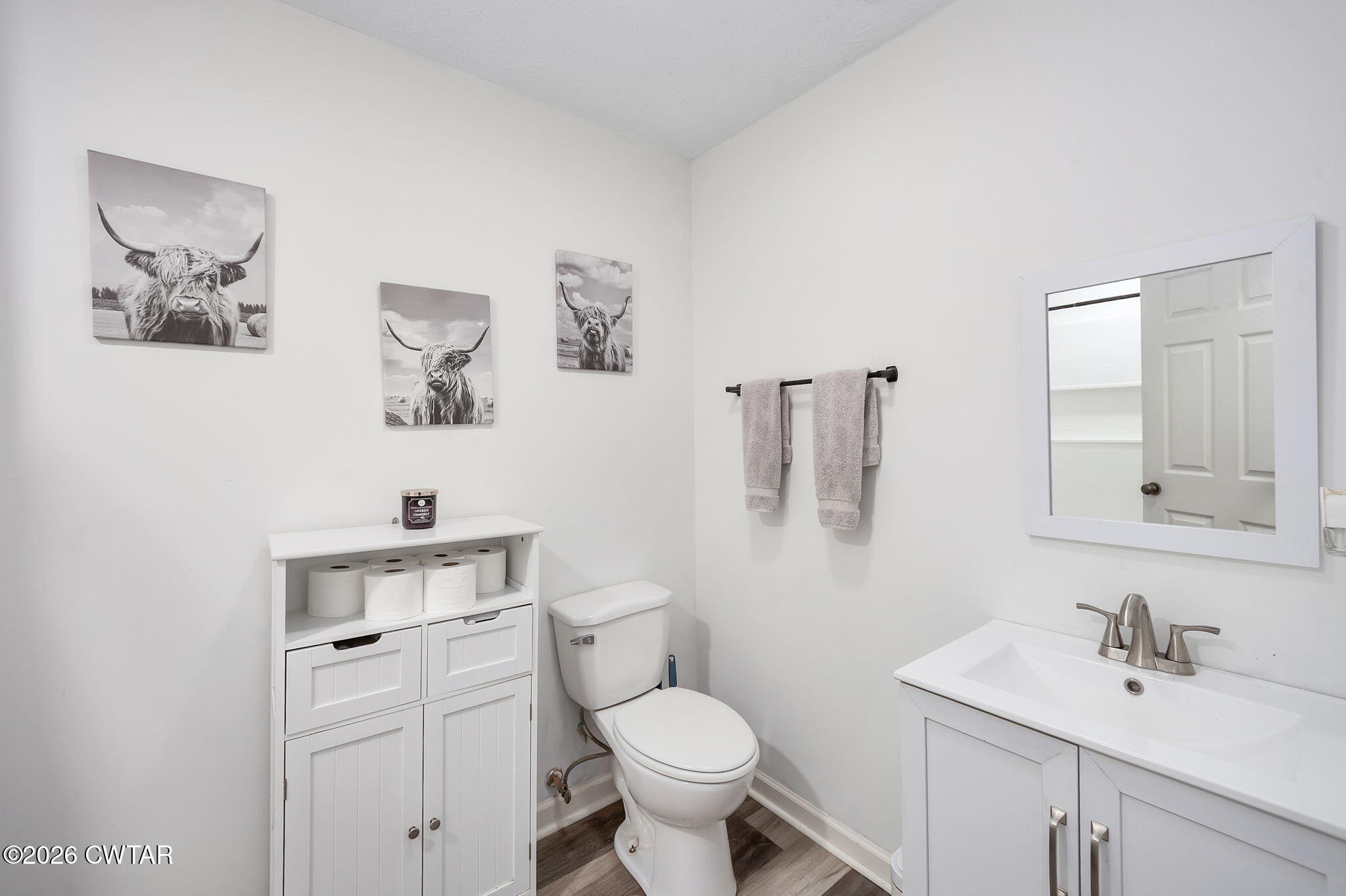 919 Bratt Thomas Road Brownsville, TN 38012 - Photo 21 of 29 a bathroom with a toilet sink and mirror