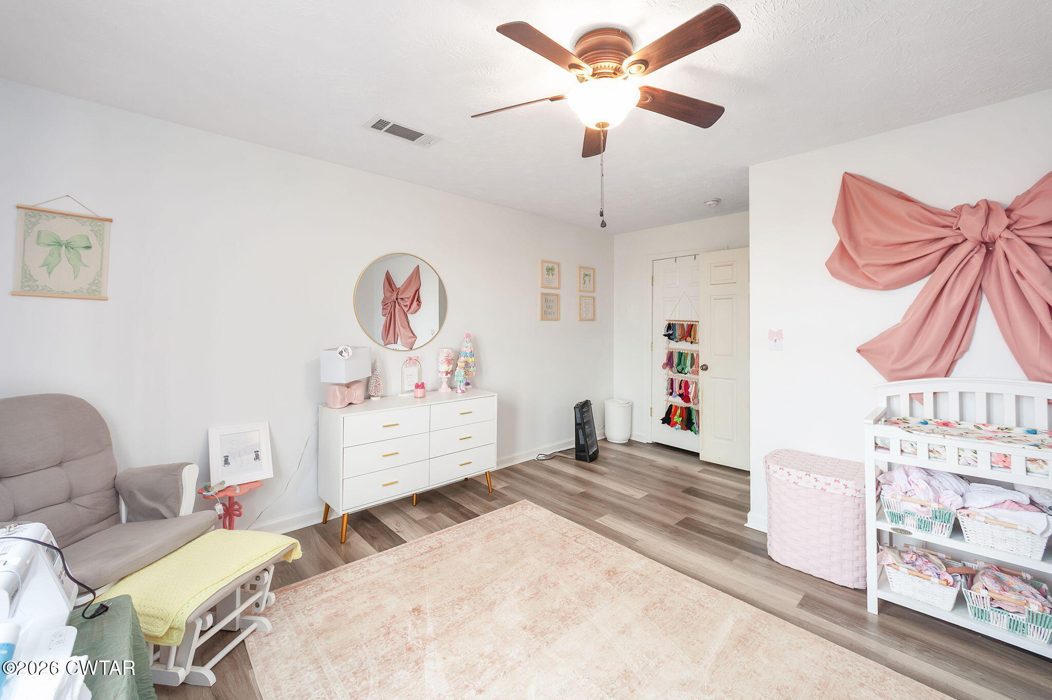 919 Bratt Thomas Road Brownsville, TN 38012 - Photo 26 of 29 a bedroom with a bed and a chandelier