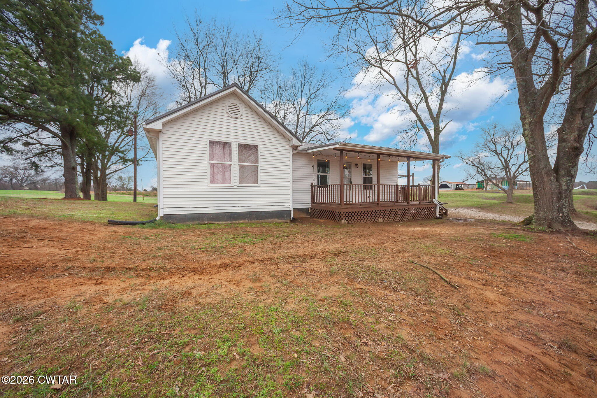 919 Bratt Thomas Road Brownsville, TN 38012 - Photo 3 of 29 a view of a house with a yard and large trees