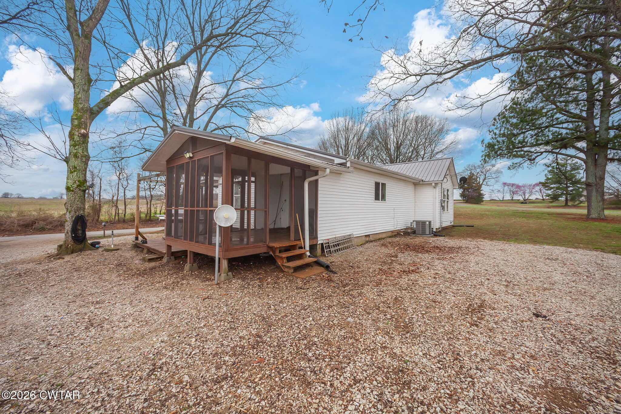 919 Bratt Thomas Road Brownsville, TN 38012 - Photo 6 of 29 a wooden bench sitting in middle of a yard
