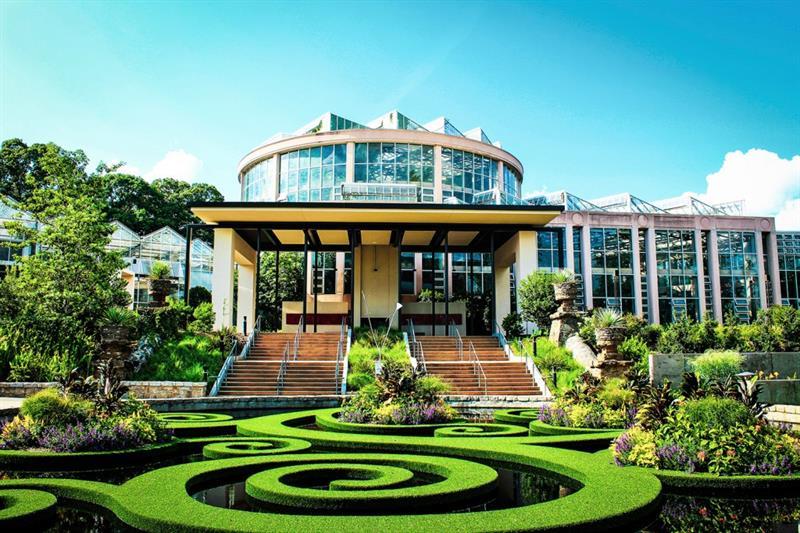 3272 Lions Ruby Lane Atlanta, GA 30349 - Photo 9 of 17 a front view of a house with a yard table and chairs