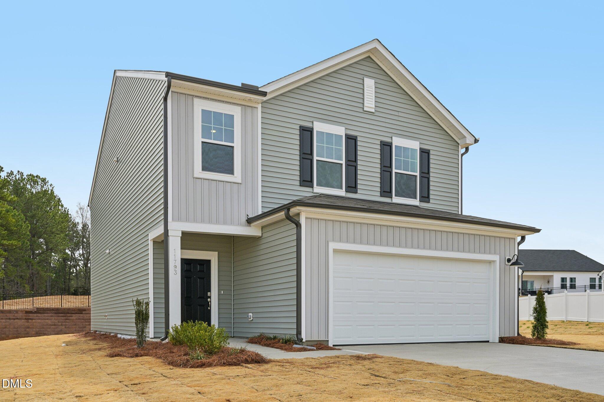 11793 Salers Loop Middlesex, NC 27557 - Photo 1 of 53 a front view of a house with a yard