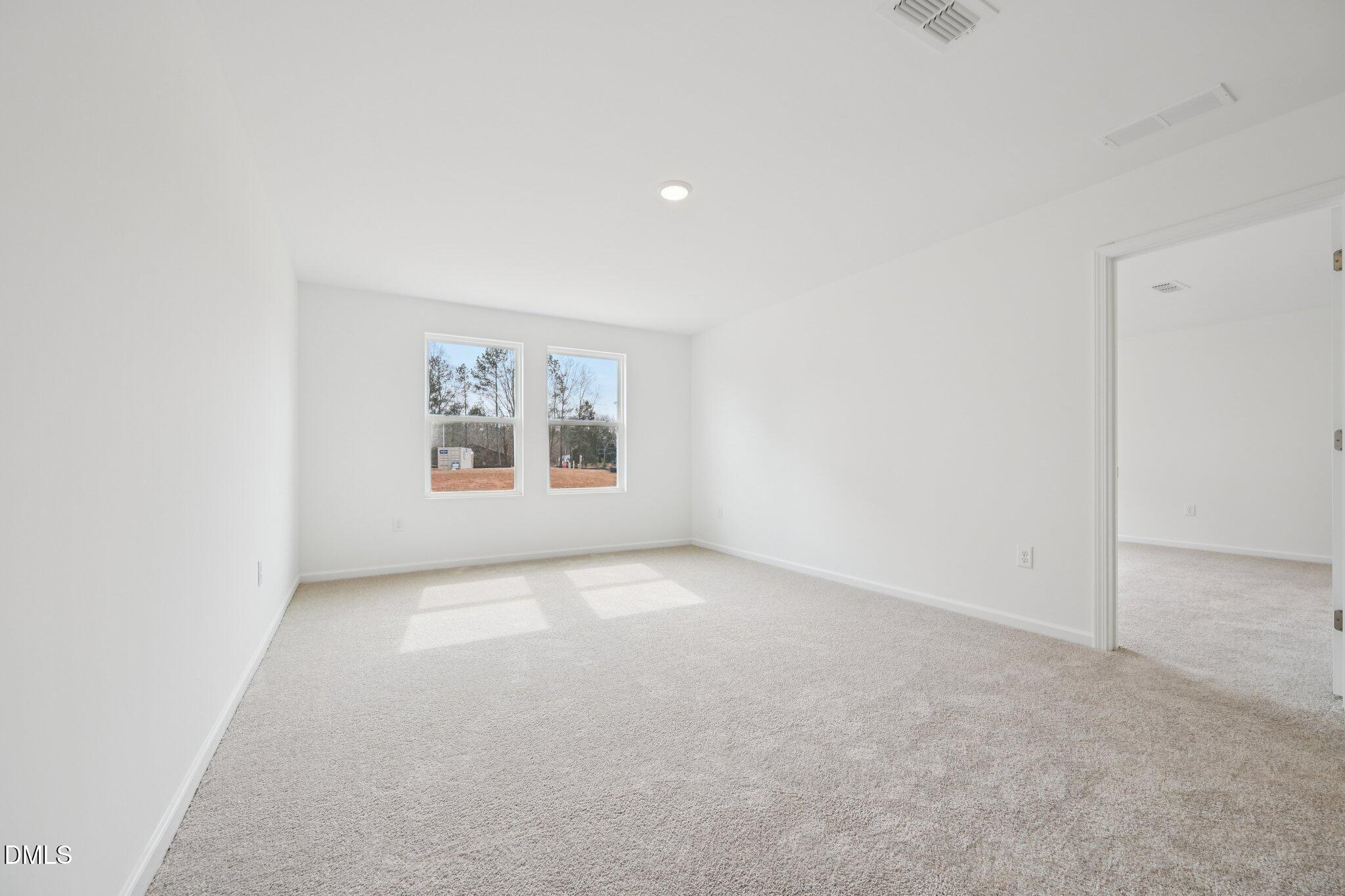 11793 Salers Loop Middlesex, NC 27557 - Photo 23 of 53 an empty room with windows and cabinet