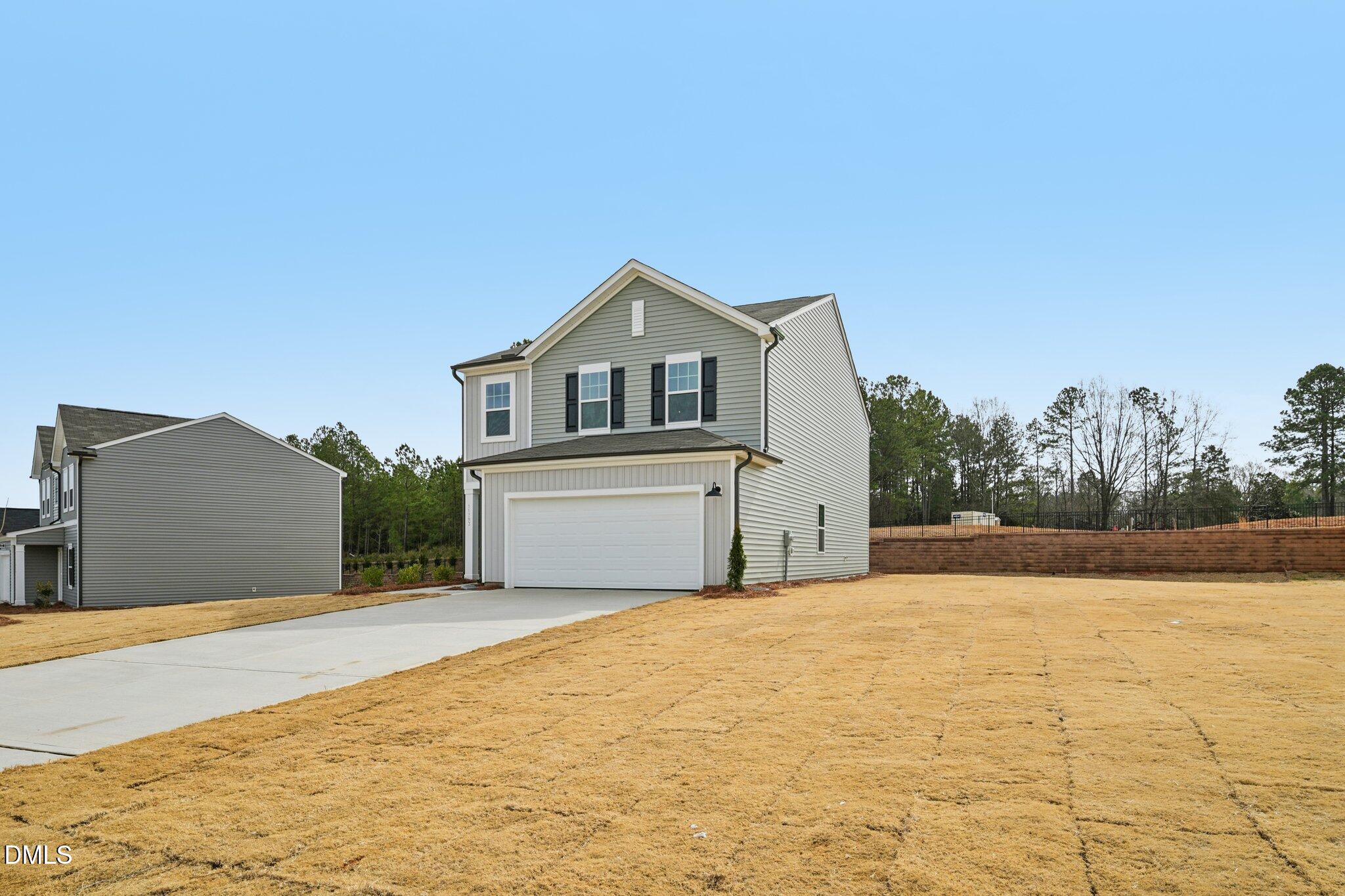 11793 Salers Loop Middlesex, NC 27557 - Photo 3 of 53 a view of a house with a yard