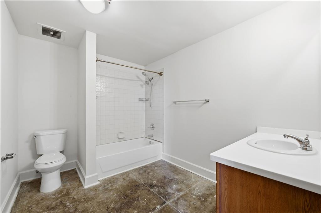 505 Whitehall Street Southwest, Unit 204 Atlanta, GA 30303 - Photo 14 of 33 a bathroom with a sink toilet and shower
