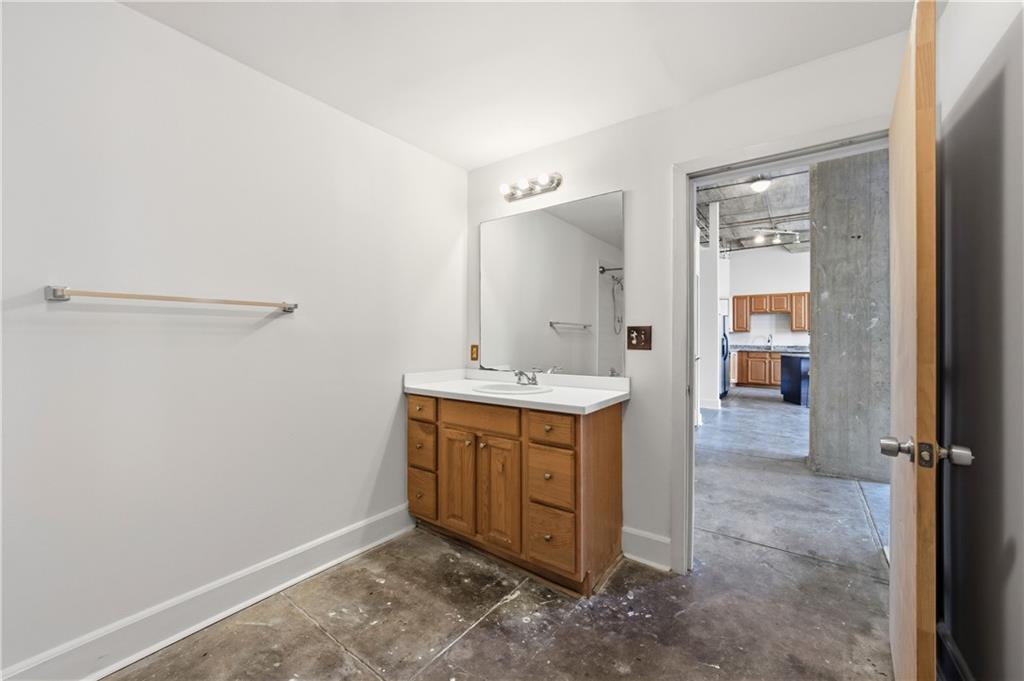 505 Whitehall Street Southwest, Unit 204 Atlanta, GA 30303 - Photo 15 of 33 a bathroom with a sink and mirror