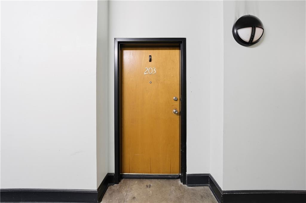 505 Whitehall Street Southwest, Unit 204 Atlanta, GA 30303 - Photo 23 of 33 a view of a small space with wooden floor