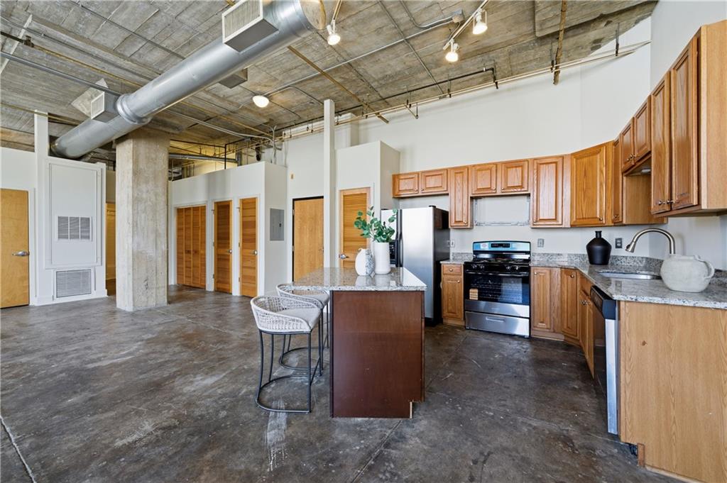 505 Whitehall Street Southwest, Unit 204 Atlanta, GA 30303 - Photo 8 of 33 a kitchen with granite countertop lots of counter top space
