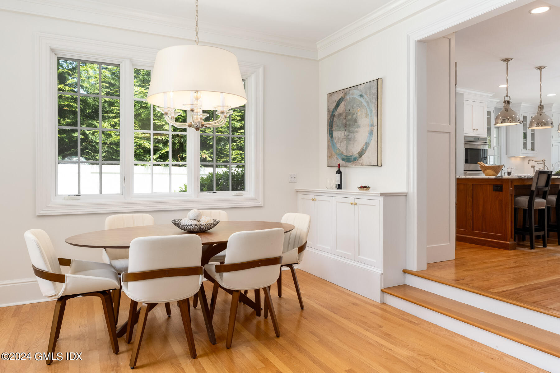 89 Shore Road Old Greenwich, CT 06870 - Photo 12 of 36 a view of a dining room with furniture window and wooden floor