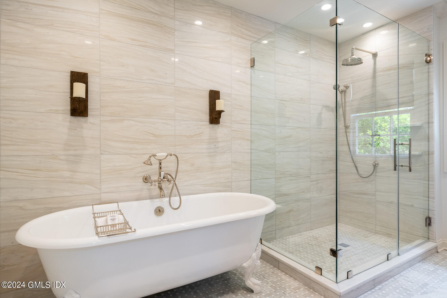 89 Shore Road Old Greenwich, CT 06870 - Photo 19 of 36 a bathroom with a shower and mirror