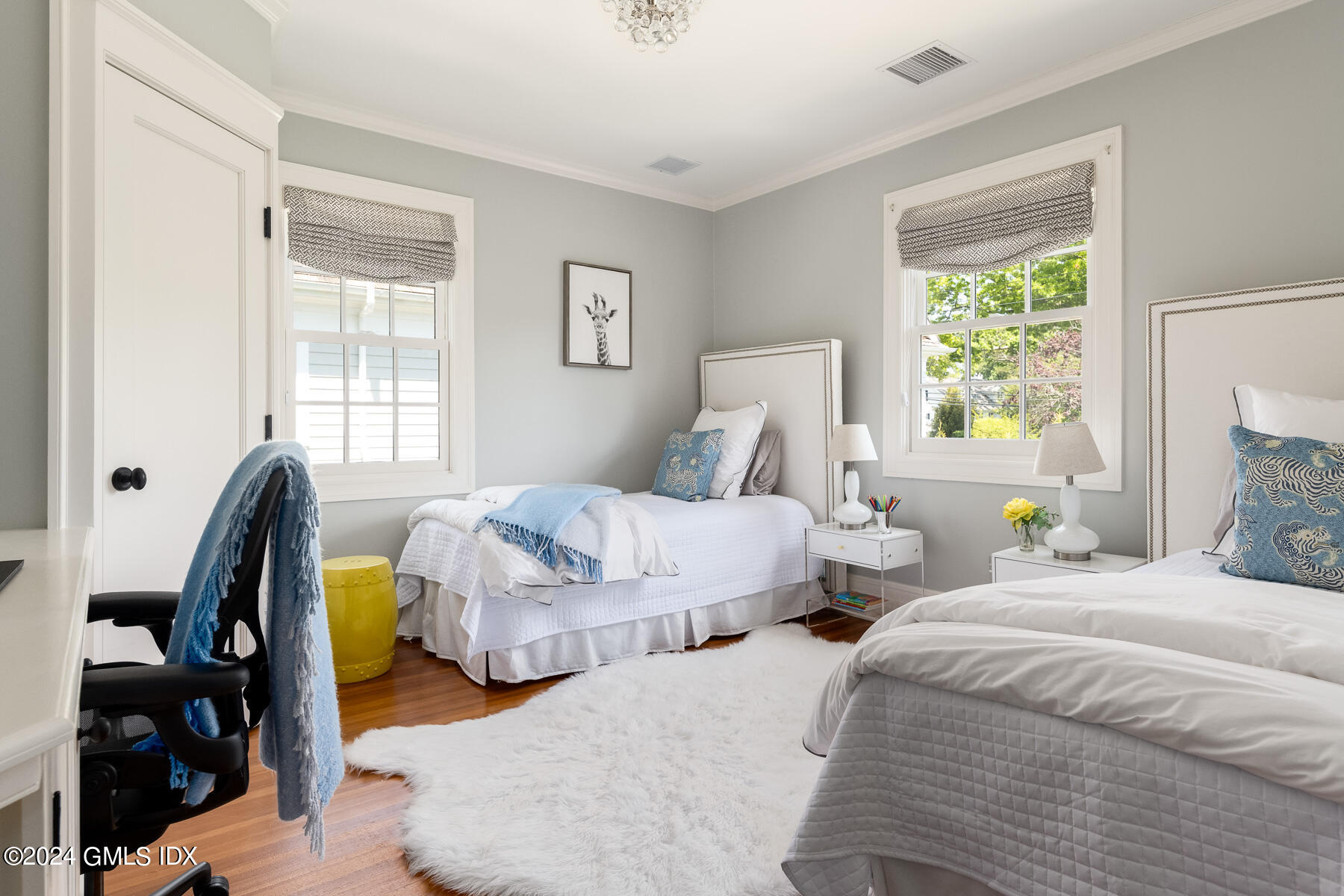 89 Shore Road Old Greenwich, CT 06870 - Photo 21 of 36 a bedroom with two beds and a window
