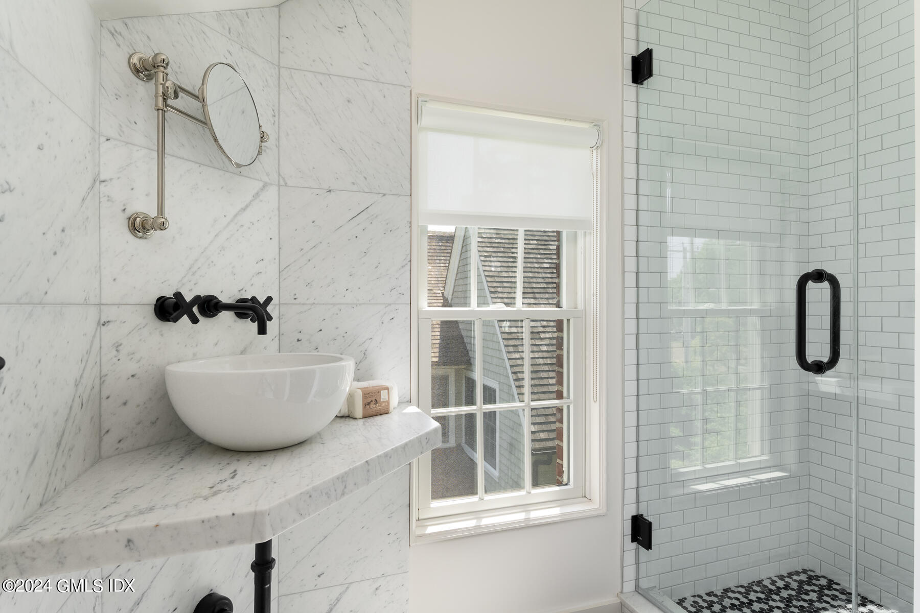 89 Shore Road Old Greenwich, CT 06870 - Photo 26 of 36 a bathroom with a bathtub and shower