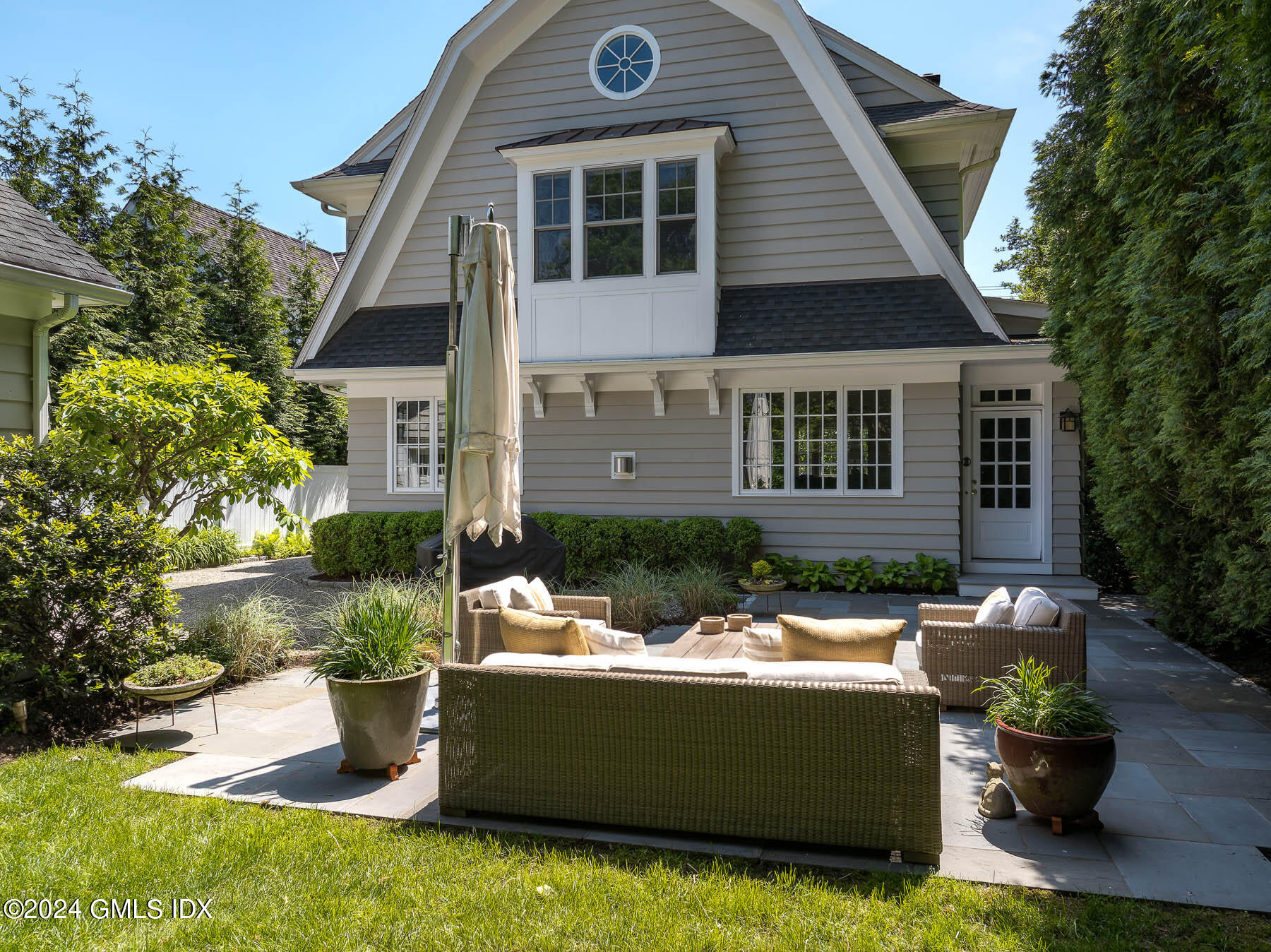 89 Shore Road Old Greenwich, CT 06870 - Photo 28 of 36 a view of house with outdoor sitting space
