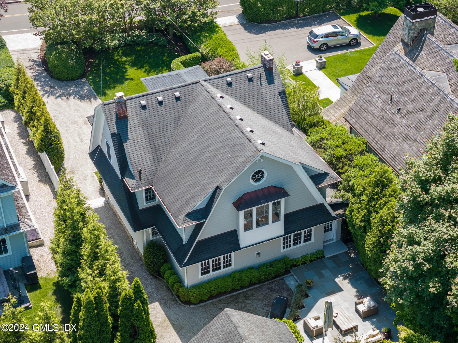 89 Shore Road Old Greenwich, CT 06870 - Photo 4 of 36 an aerial view of a house with swimming pool and garden