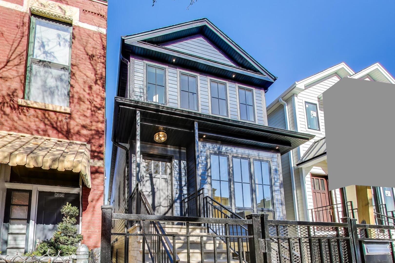 2213 West Huron Street Chicago, IL 60612 - Photo 1 of 42 a view of a house with a small yard and plants