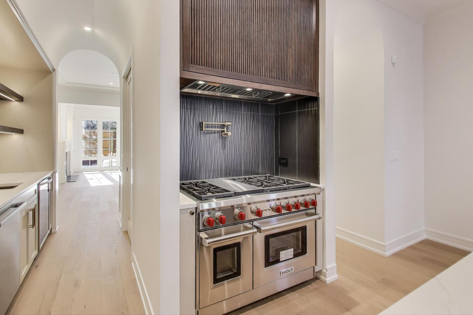 2213 West Huron Street Chicago, IL 60612 - Photo 14 of 42 a stove top oven sitting inside of a kitchen