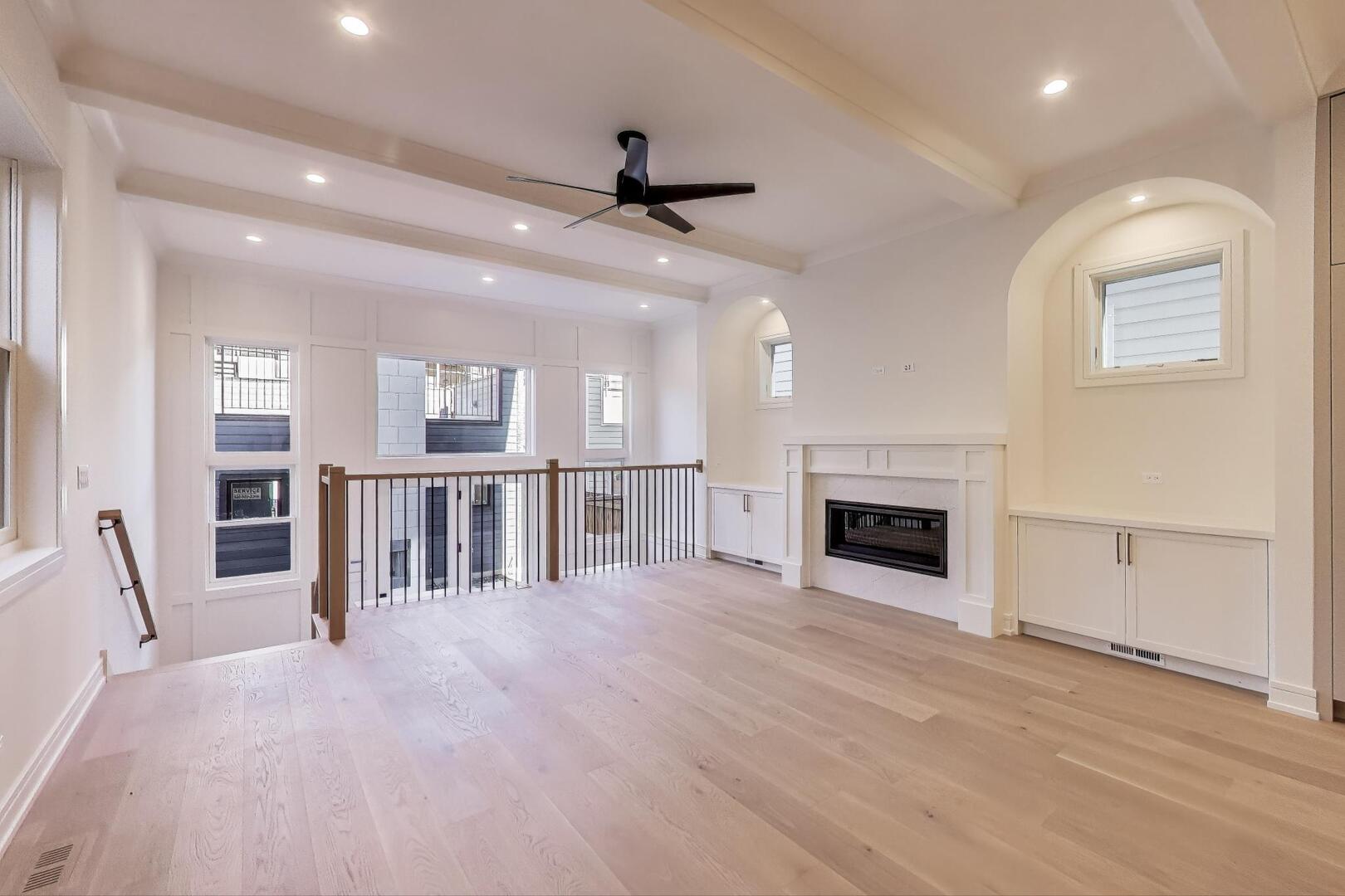 2213 West Huron Street Chicago, IL 60612 - Photo 18 of 42 a view of an empty room with a fireplace and a window