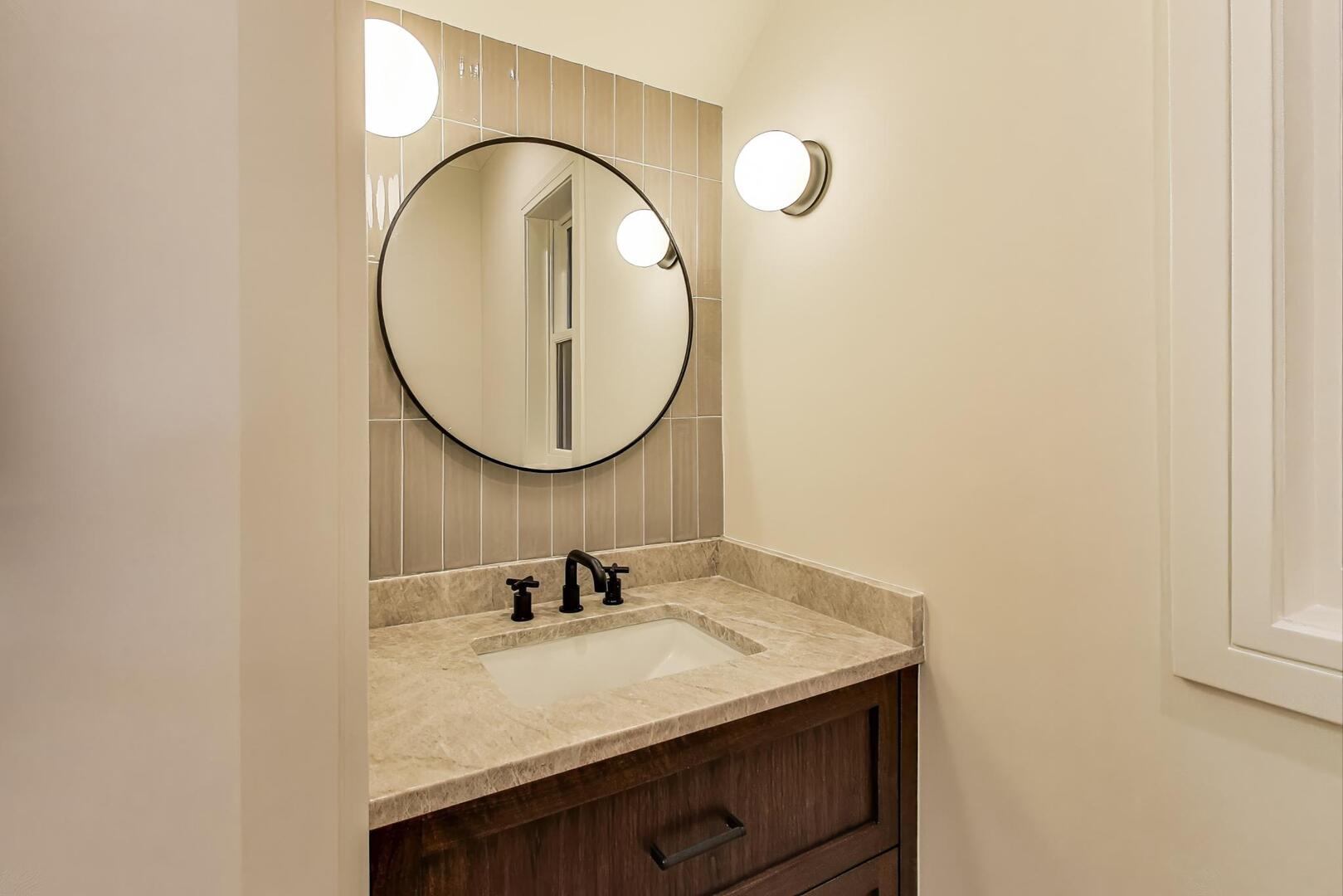 2213 West Huron Street Chicago, IL 60612 - Photo 21 of 42 a bathroom with a sink and a mirror