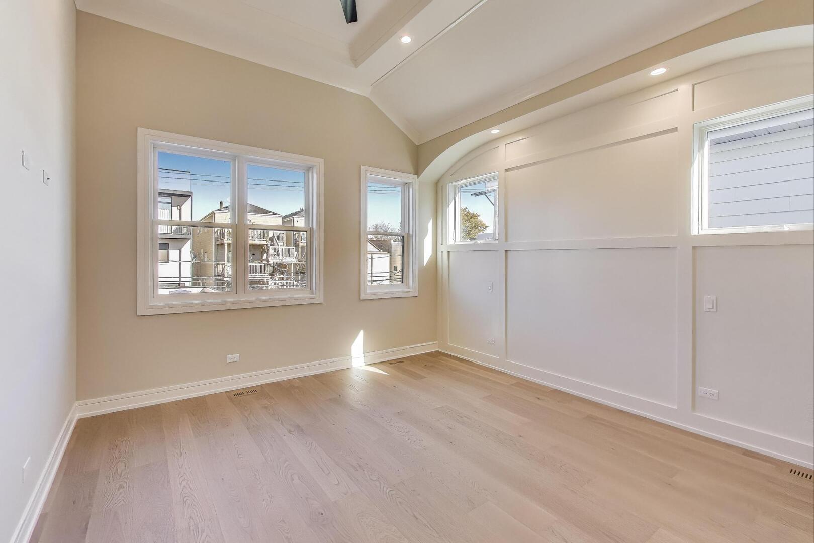 2213 West Huron Street Chicago, IL 60612 - Photo 23 of 42 an empty room with windows and refrigerator