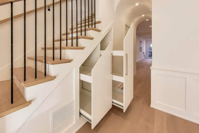 a kitchen with a sink and a refrigerator