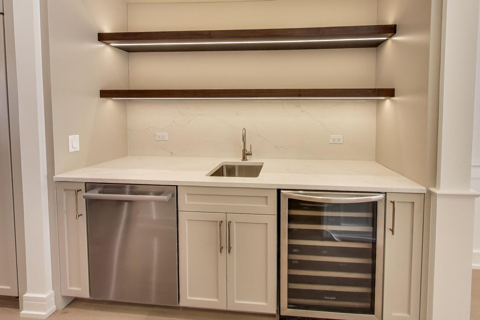 2213 West Huron Street Chicago, IL 60612 - Photo 10 of 42 a kitchen with a sink and a refrigerator