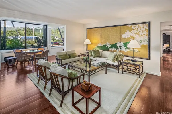 a living room with furniture and a large window
