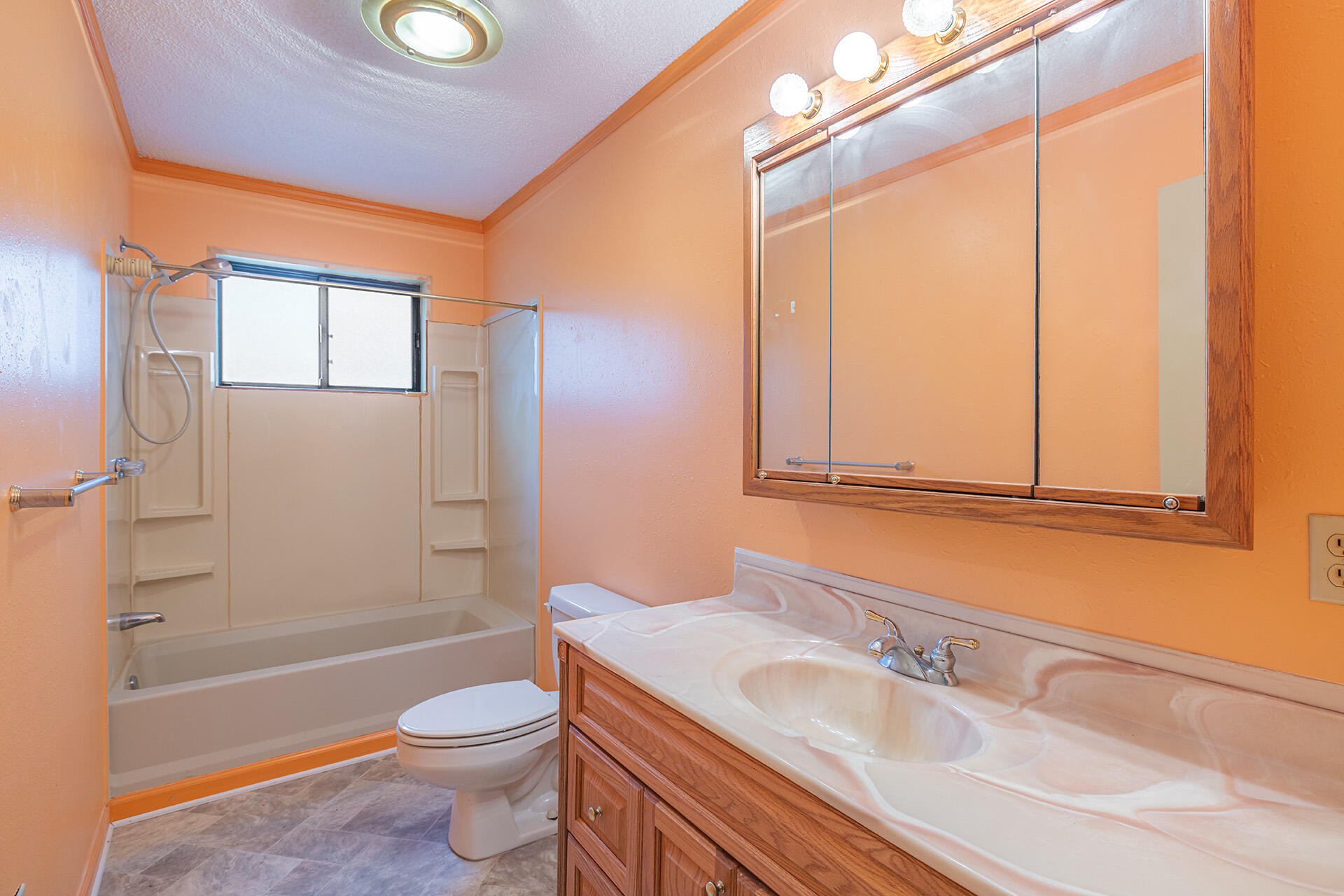 3877 Hinote Road Crestview, FL 32539 - Photo 18 of 33 a bathroom with a sink a toilet and shower