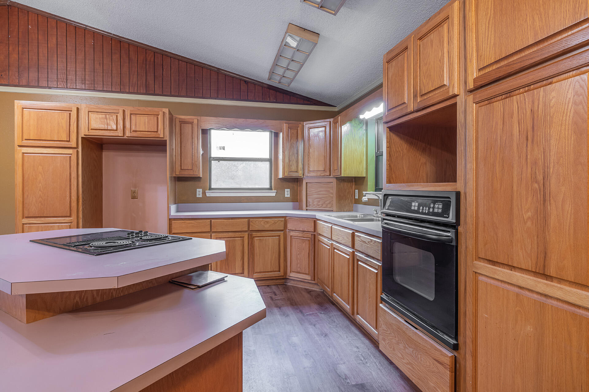 3877 Hinote Road Crestview, FL 32539 - Photo 7 of 33 a kitchen with kitchen island granite countertop a stove and a refrigerator