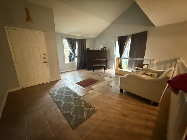 a living room with furniture and a table