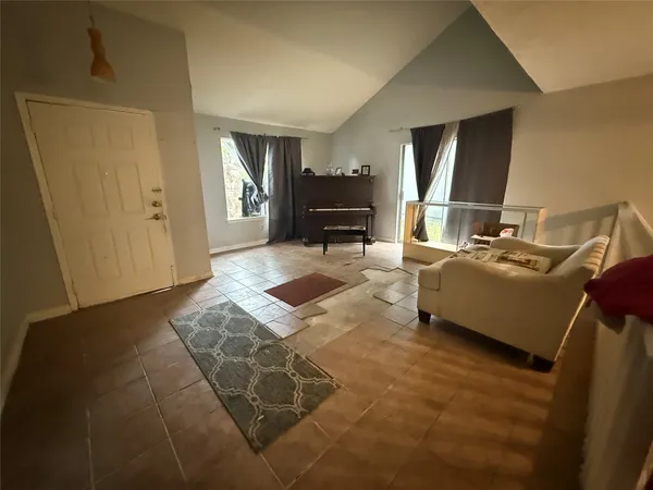 a living room with furniture and a table