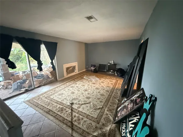 a view of an empty room and wooden floor