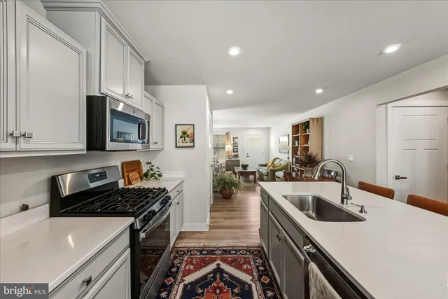 a kitchen that has a sink and a stove