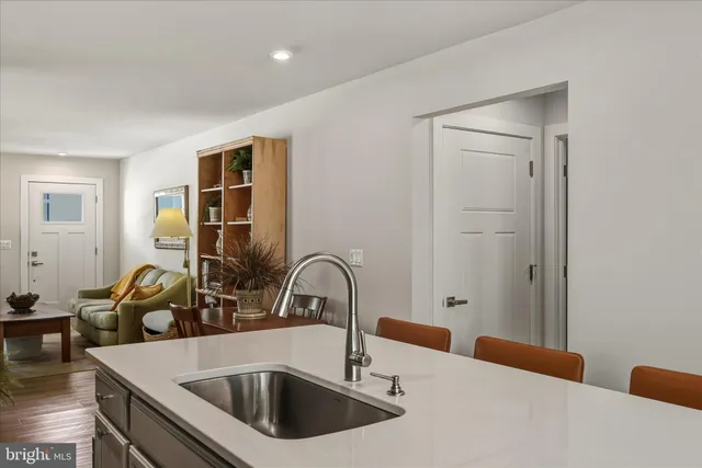 a kitchen with a sink and a refrigerator