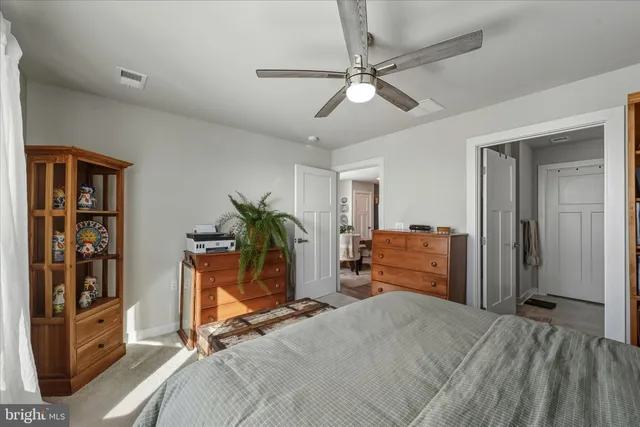 a bedroom with furniture and a window