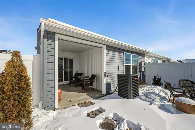 a view of a patio with table and chairs and potted plants
