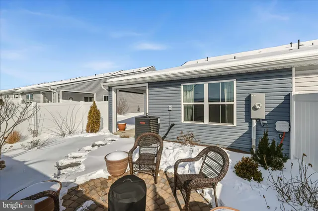 a backyard of a house with outdoor seating
