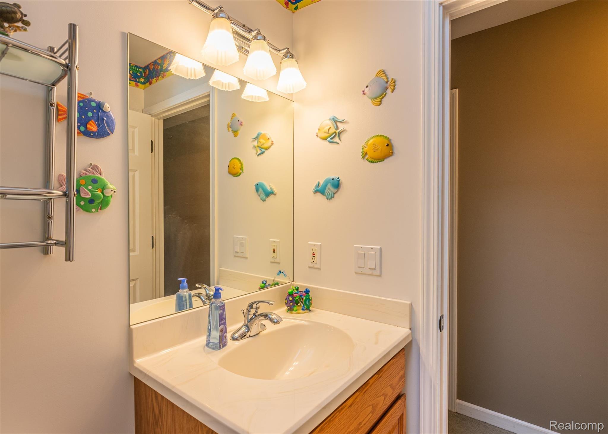 10151 Meskill Road Columbus, MI 48063 - Photo 22 of 39 Full bathroom upstairs with shower-tub combo.