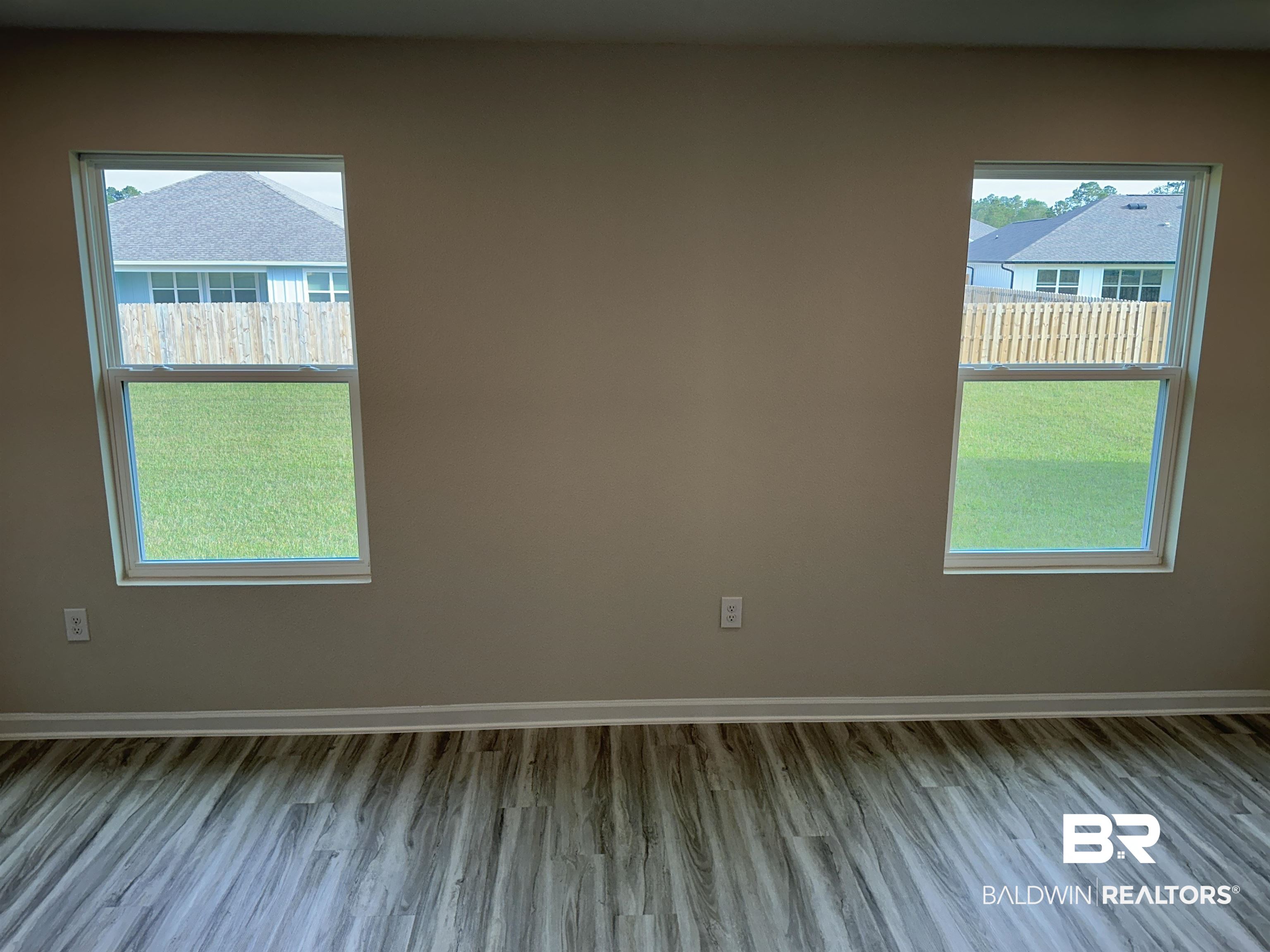 8850 Sea Star Circle Foley, AL 36535 - Photo 18 of 29 Unfurnished room featuring light wood-type flooring and a wealth of natural light