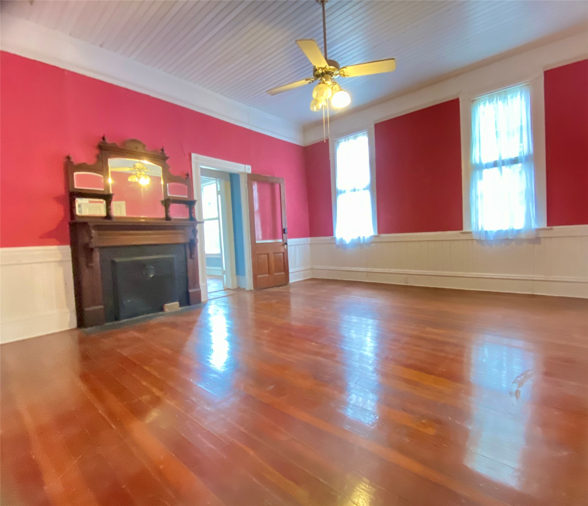 223 East Robert Toombs Avenue Washington, GA 30673 - Photo 25 of 46 a view of an empty room with a window and wooden floor