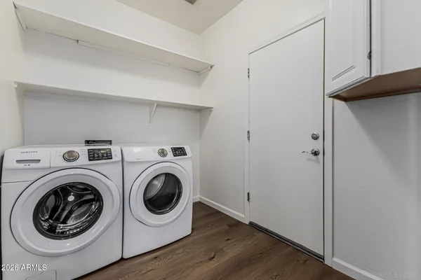 a utility room with dryer and washer