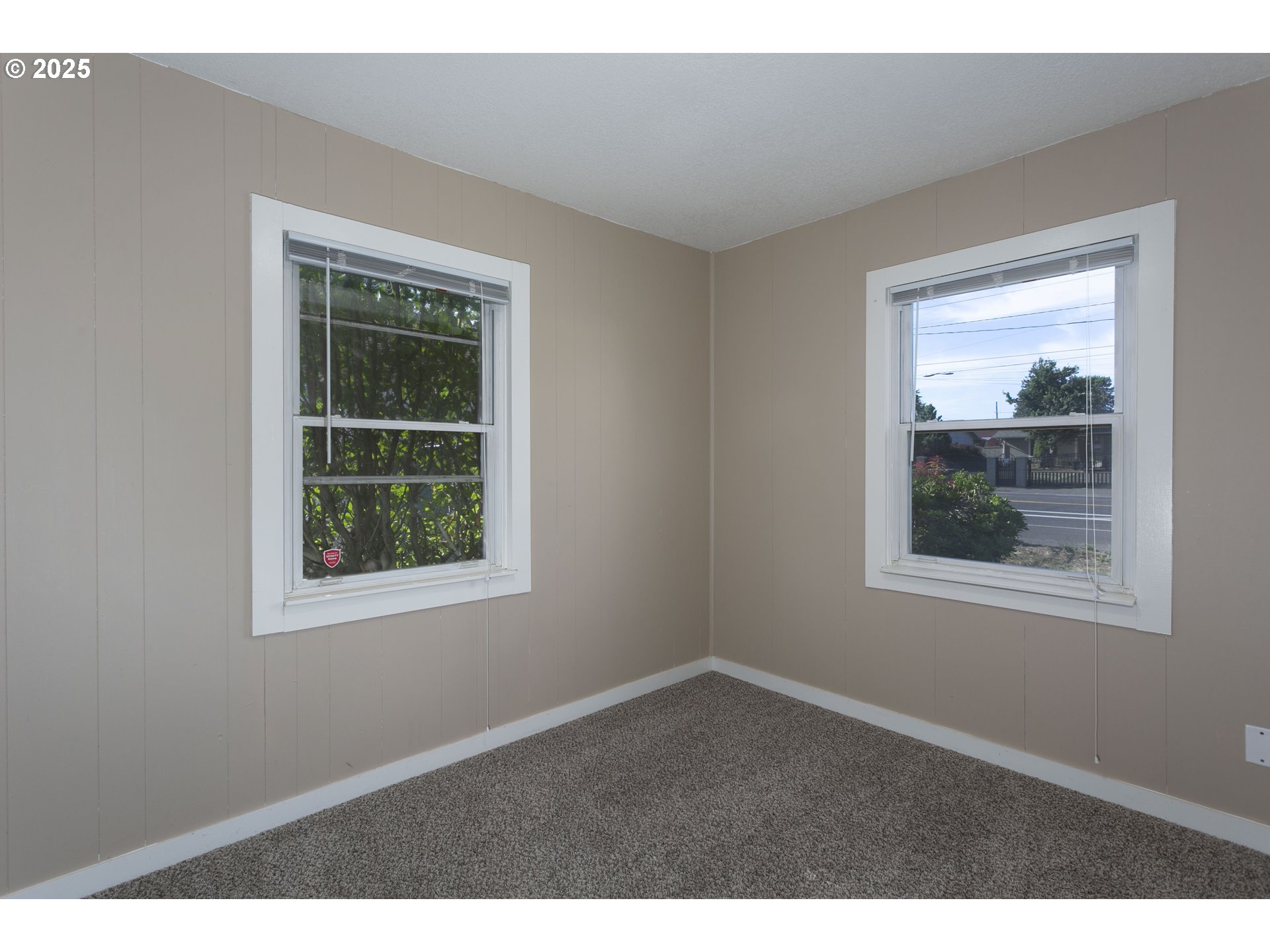 9628 Southeast Holgate Boulevard Portland, OR 97266 - Photo 12 of 15 a view of an empty room with a window