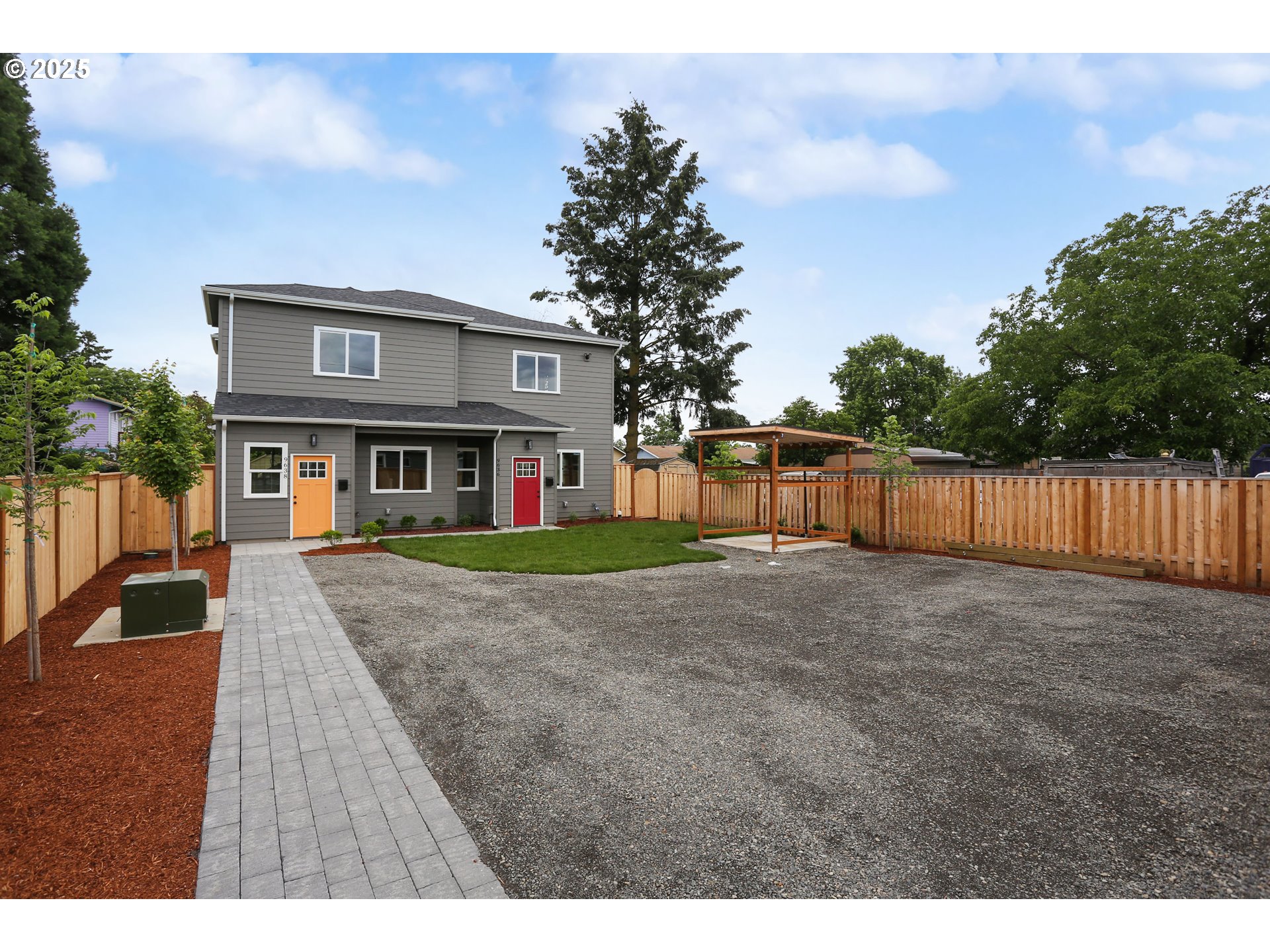 9628 Southeast Holgate Boulevard Portland, OR 97266 - Photo 10 of 15 a view of an house with backyard and trees
