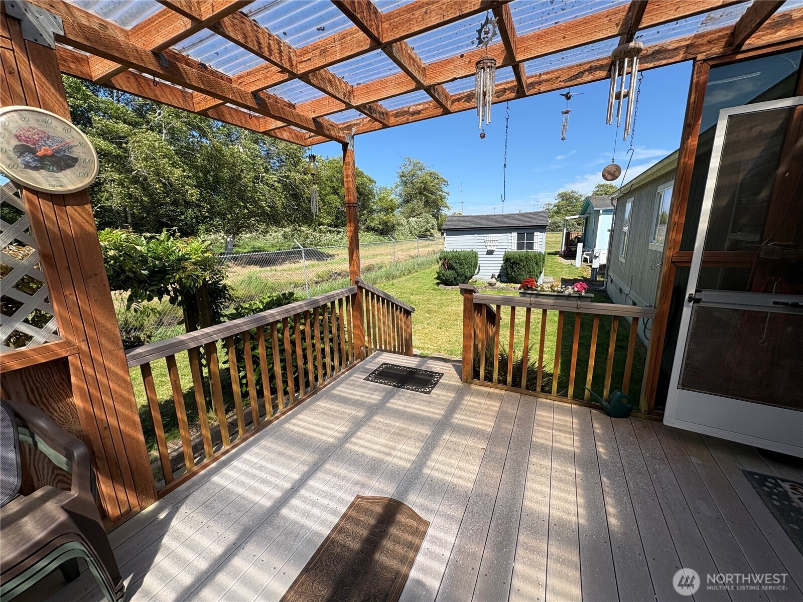 51 Meander Way Aberdeen, WA 98520 - Photo 4 of 22 a view of a patio with table and chairs potted plants with wooden floor