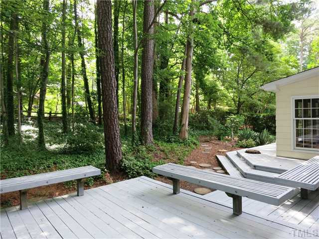 5014 Tremont Drive Raleigh, NC 27609 - Photo 22 of 25 There is a huge multi-level Deck in the private, wooded backyard, and there are 3 Storage Rms & an oversized carport. Patio/Deck